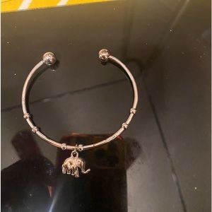 Silver bracelet, with silver elephant charm.